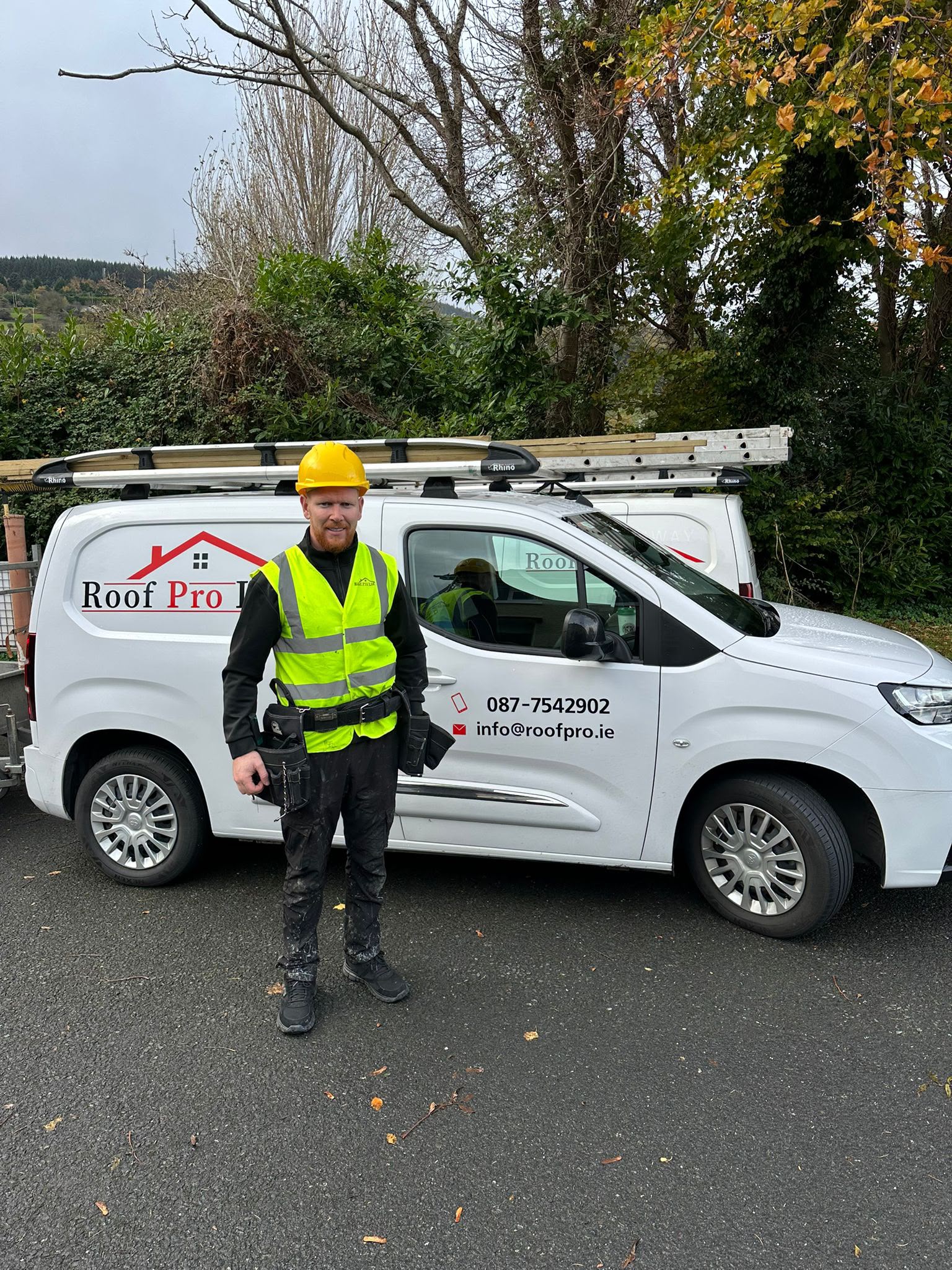 Chris O'Brien with a Roof Pro Ltd branded van in Dublin